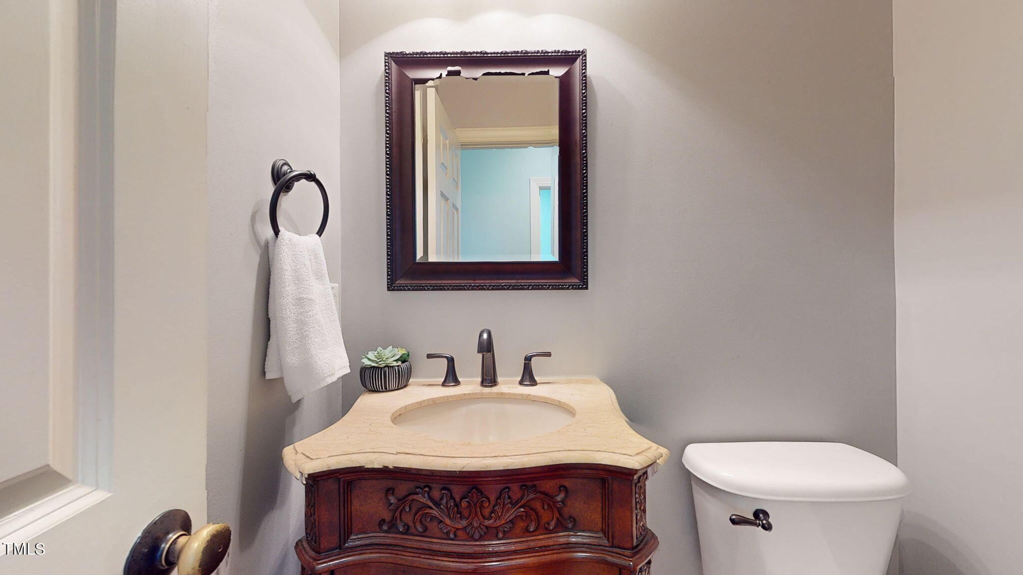 9306 Tabriz Point Raleigh, NC 27614 - Photo 19 of 46 a bathroom with a sink toilet and mirror