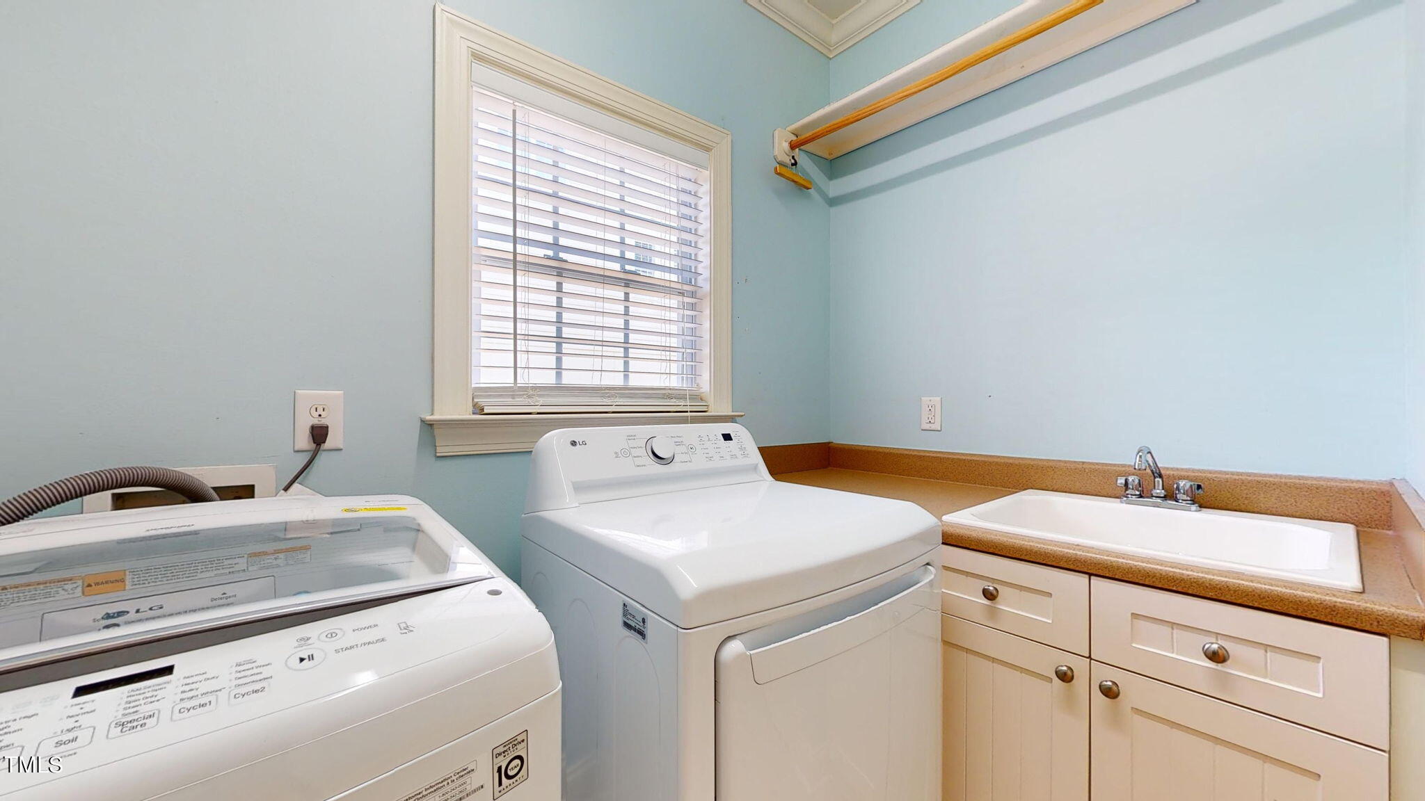 9306 Tabriz Point Raleigh, NC 27614 - Photo 20 of 46 a utility room with dryer and washer