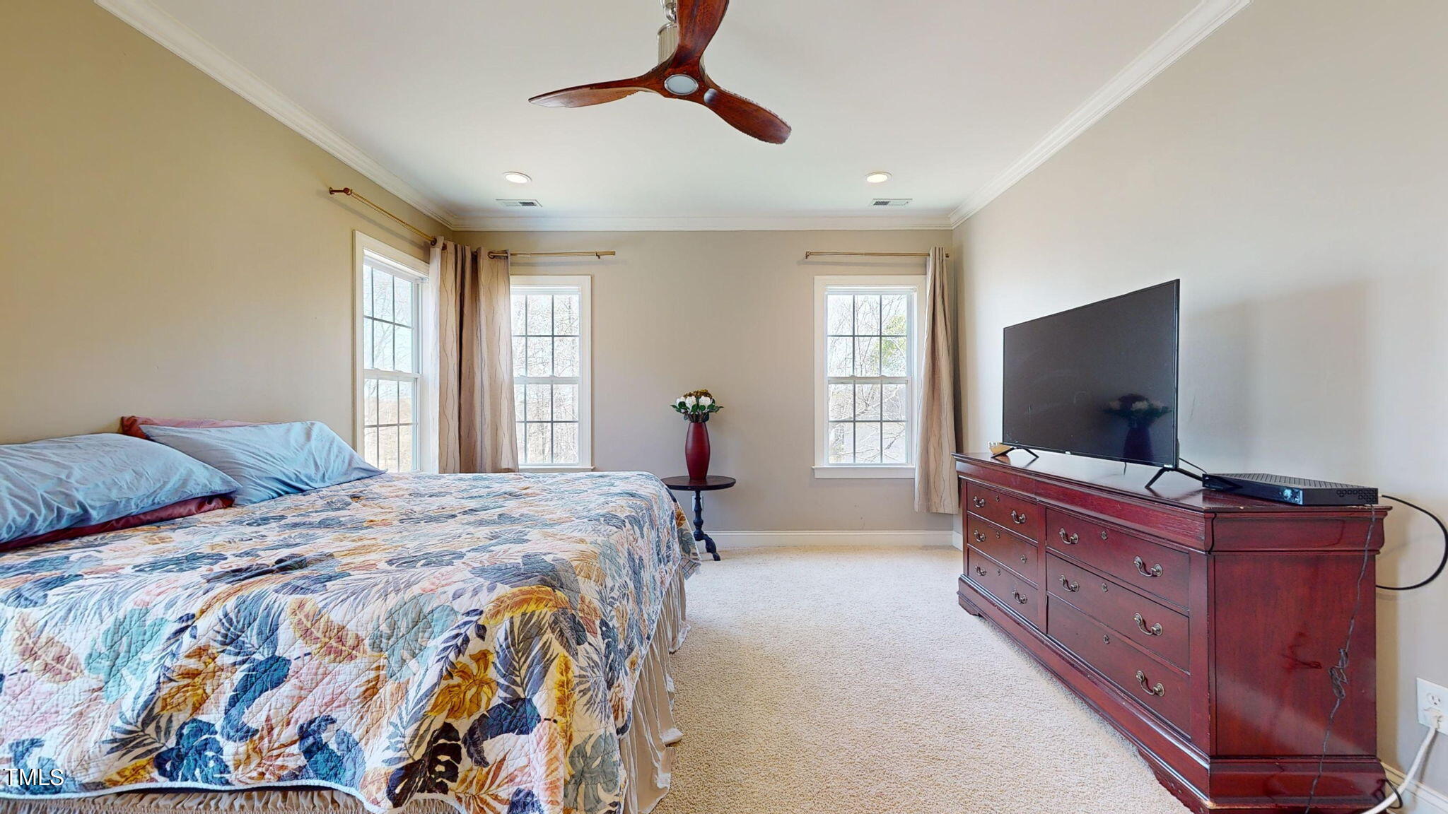 9306 Tabriz Point Raleigh, NC 27614 - Photo 21 of 46 a bedroom with a bed and a flat screen tv