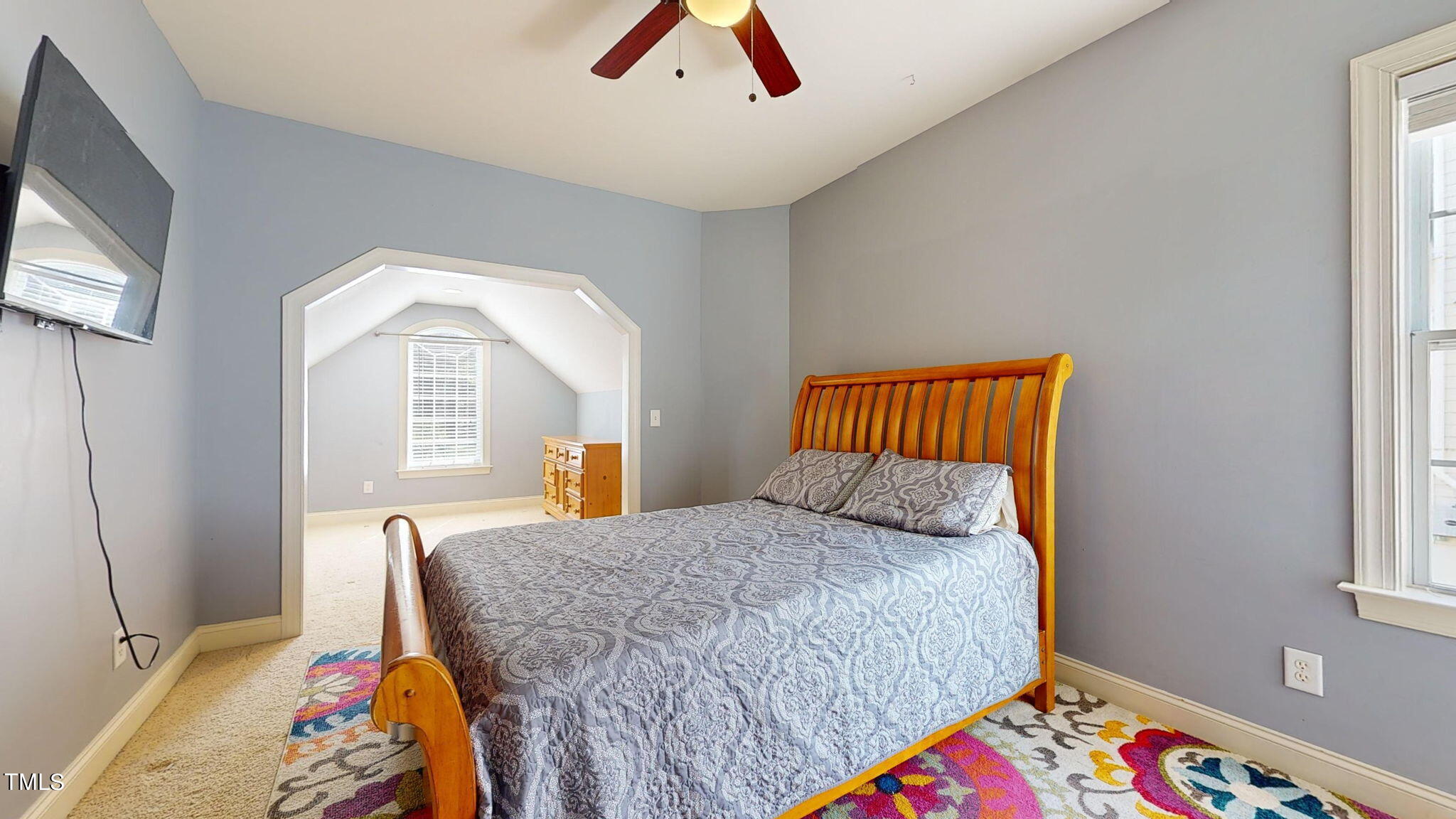 9306 Tabriz Point Raleigh, NC 27614 - Photo 27 of 46 a bedroom with a bed and a chandelier