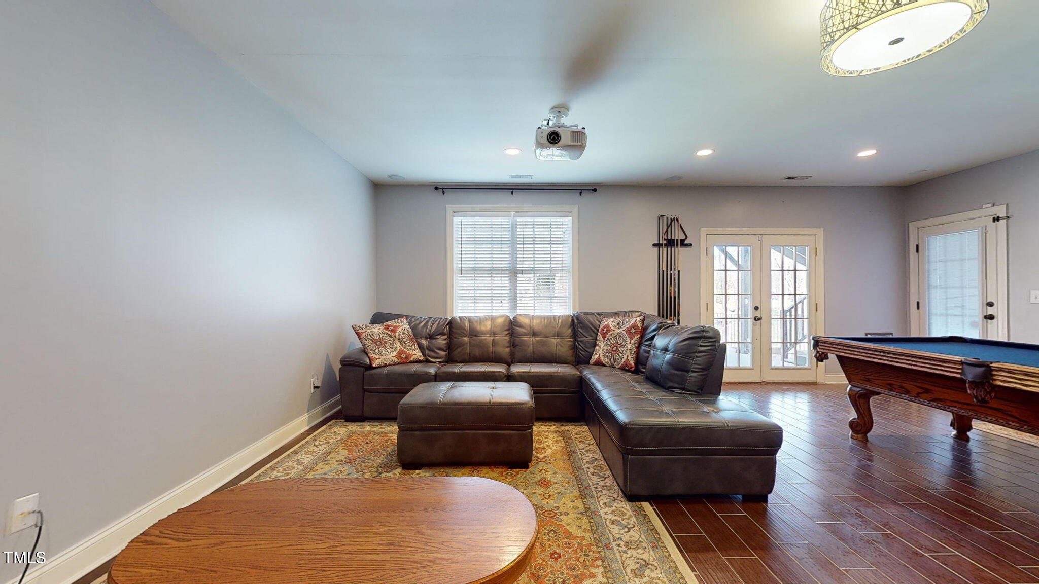 9306 Tabriz Point Raleigh, NC 27614 - Photo 33 of 46 a living room with furniture and a wooden floor