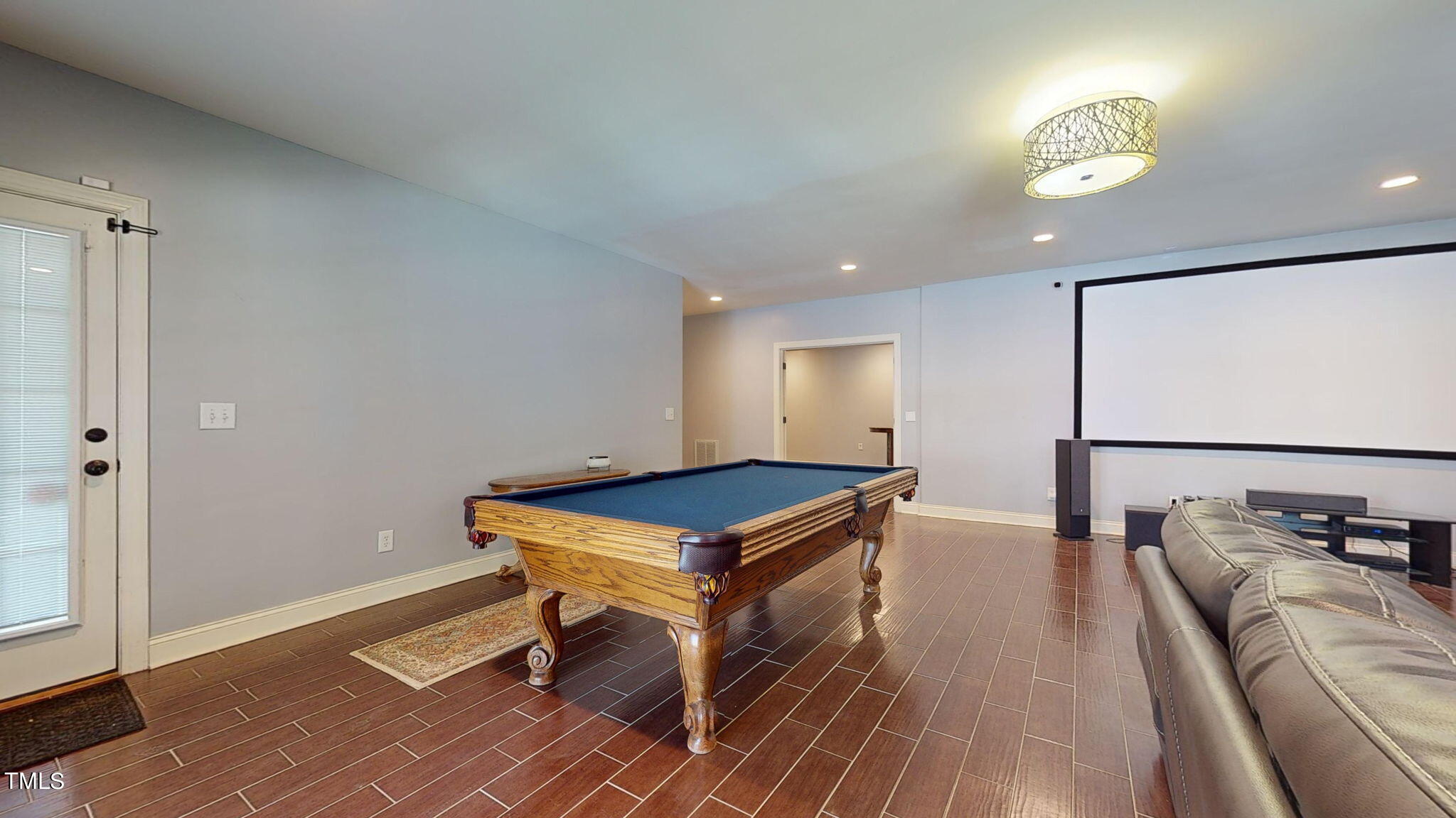 9306 Tabriz Point Raleigh, NC 27614 - Photo 34 of 46 a room with wooden floor and furniture