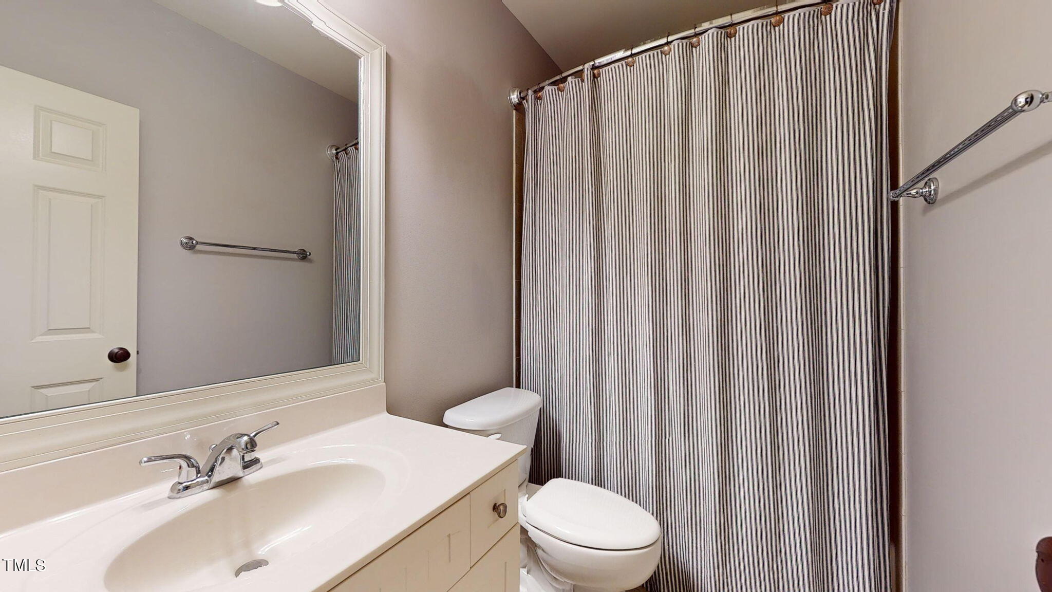 9306 Tabriz Point Raleigh, NC 27614 - Photo 37 of 46 a bathroom with a sink a toilet and shower