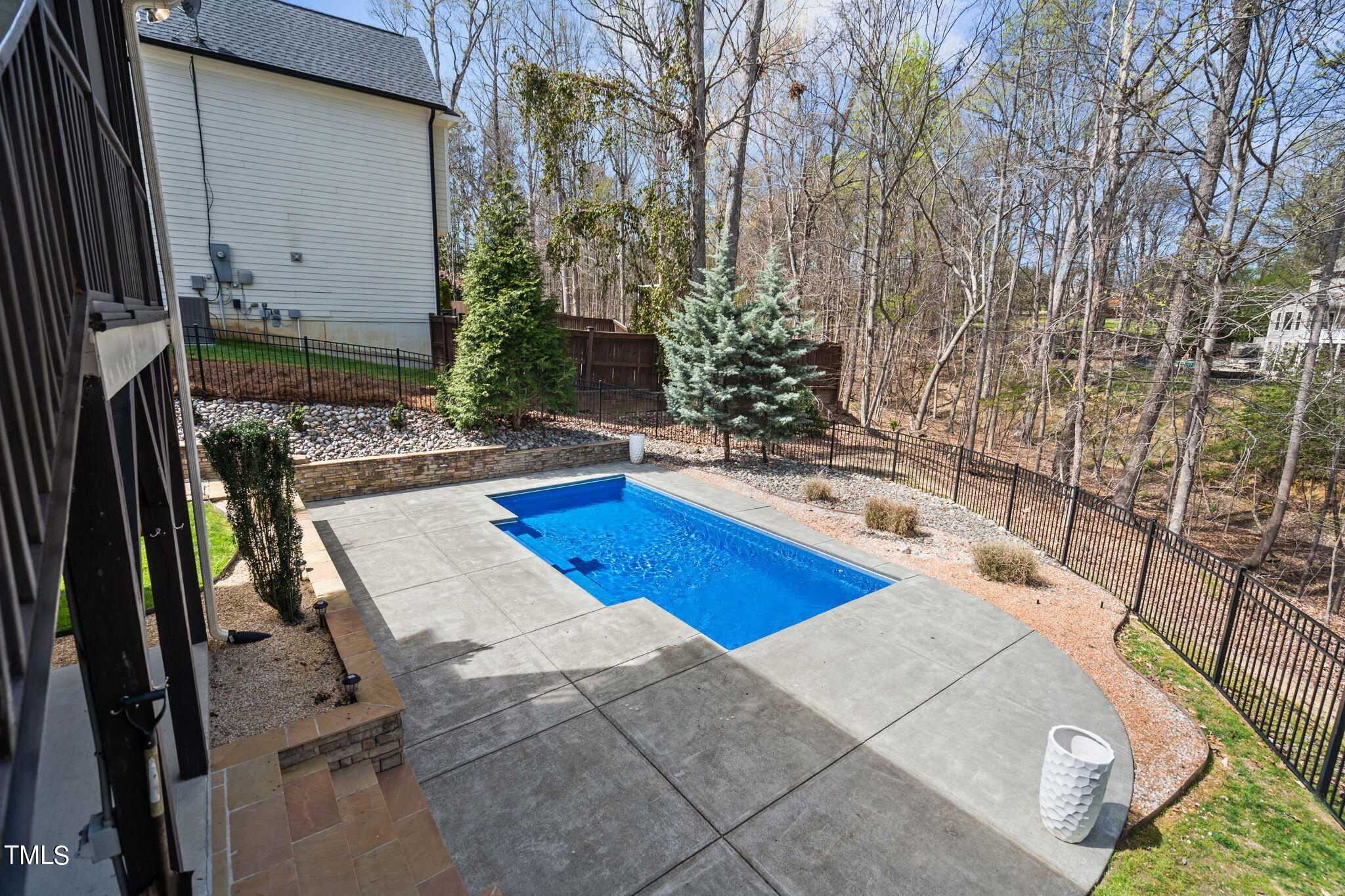 9306 Tabriz Point Raleigh, NC 27614 - Photo 45 of 46 a view of a swimming pool with an outdoor seating