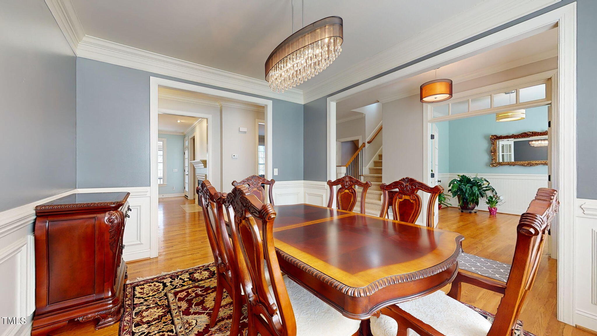9306 Tabriz Point Raleigh, NC 27614 - Photo 9 of 46 a dining room with furniture and wooden floor