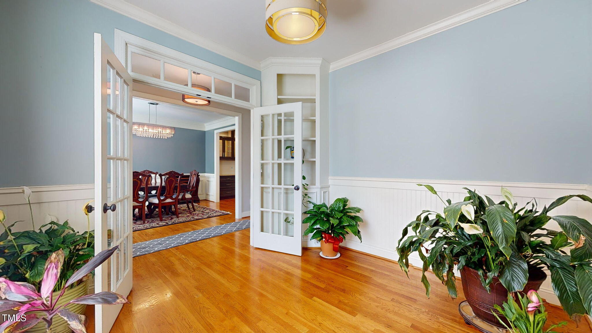 9306 Tabriz Point Raleigh, NC 27614 - Photo 10 of 46 a living room with furniture potted plants and wooden floor