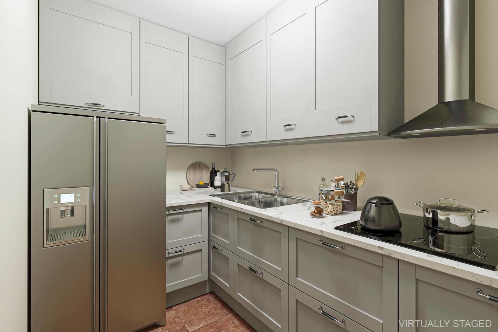 a kitchen with stainless steel appliances white cabinets and a refrigerator