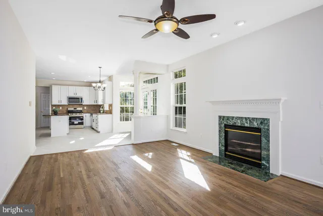 a view of a kitchen with furniture and a fireplace
