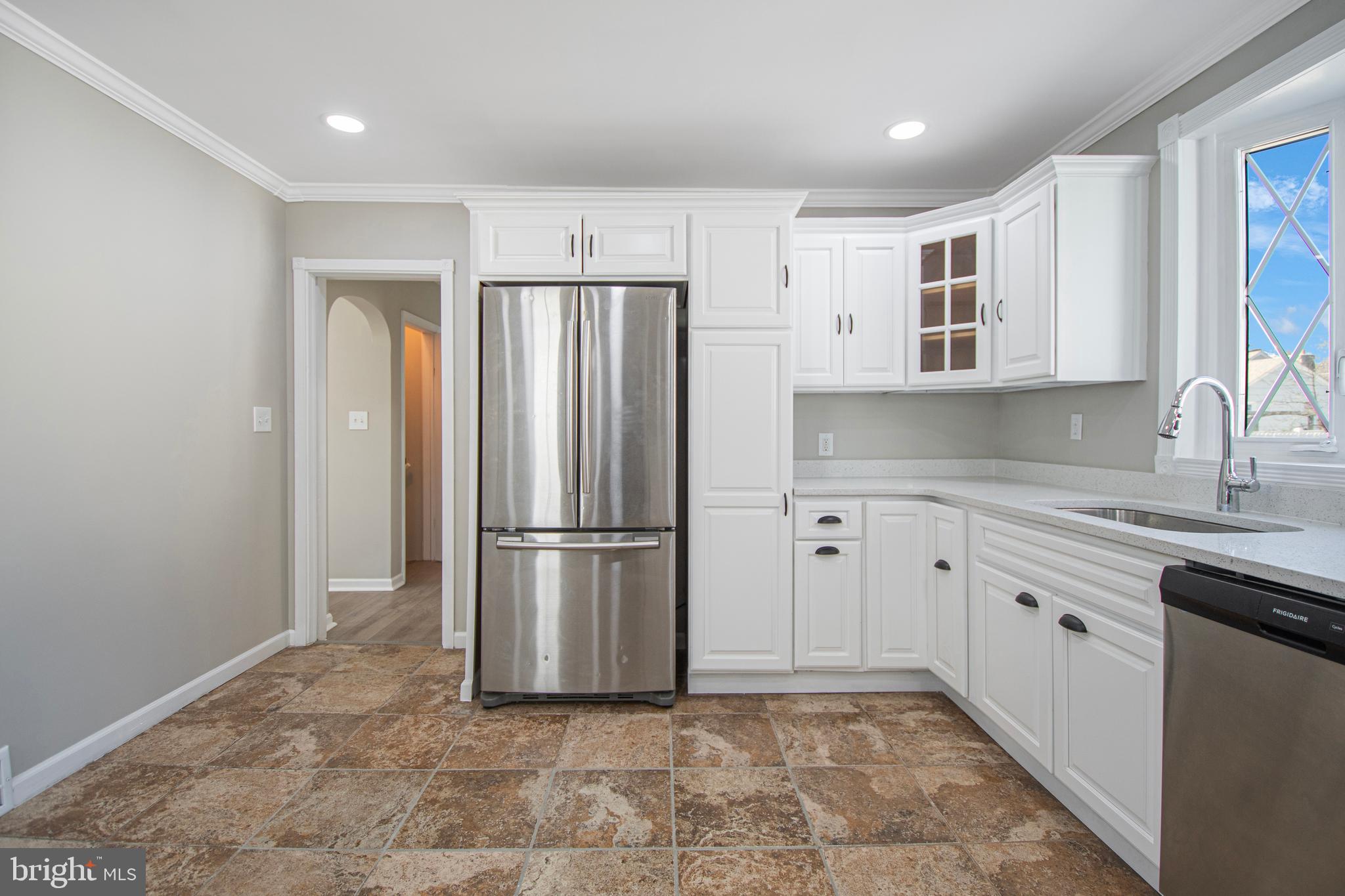 331 Westmoreland Drive Ewing, NJ 08618 - Photo 11 of 28 a kitchen with a refrigerator sink and cabinets
