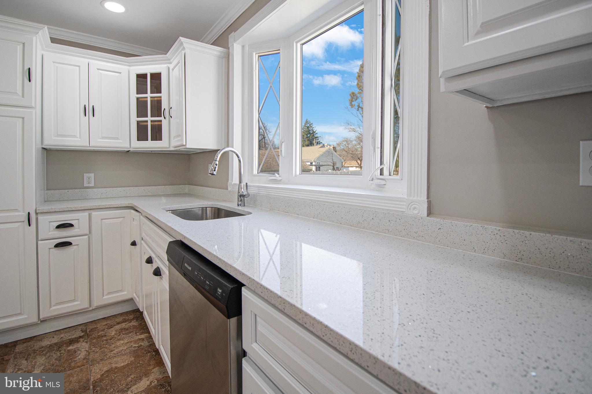 331 Westmoreland Drive Ewing, NJ 08618 - Photo 12 of 28 a view of a kitchen cabinets a sink and dishwasher in a kitchen