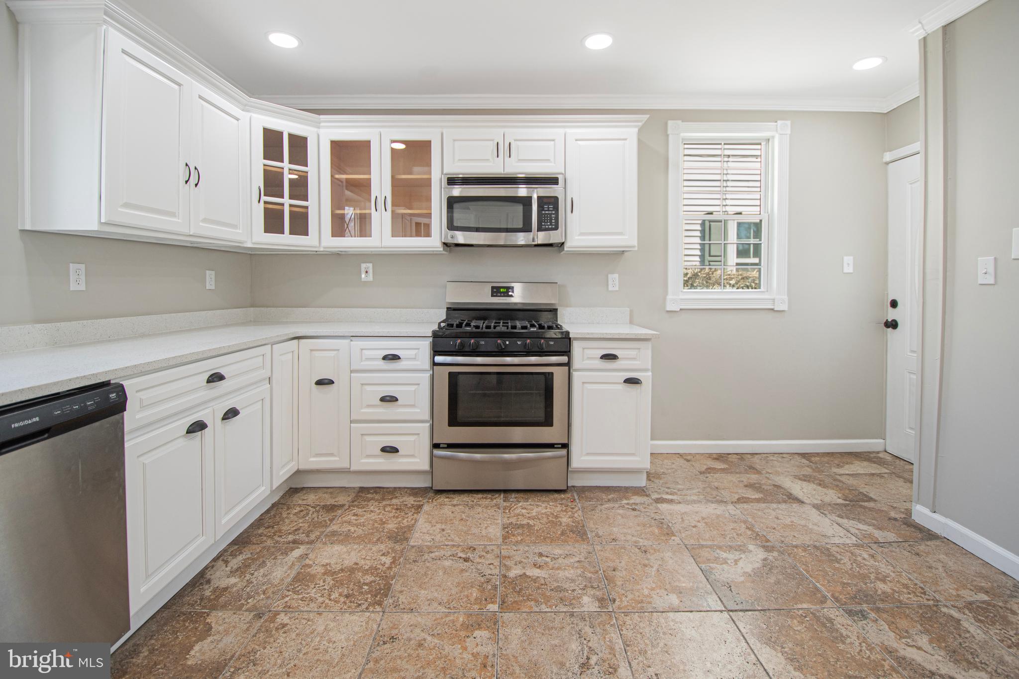 331 Westmoreland Drive Ewing, NJ 08618 - Photo 13 of 28 a kitchen with white cabinets and appliances