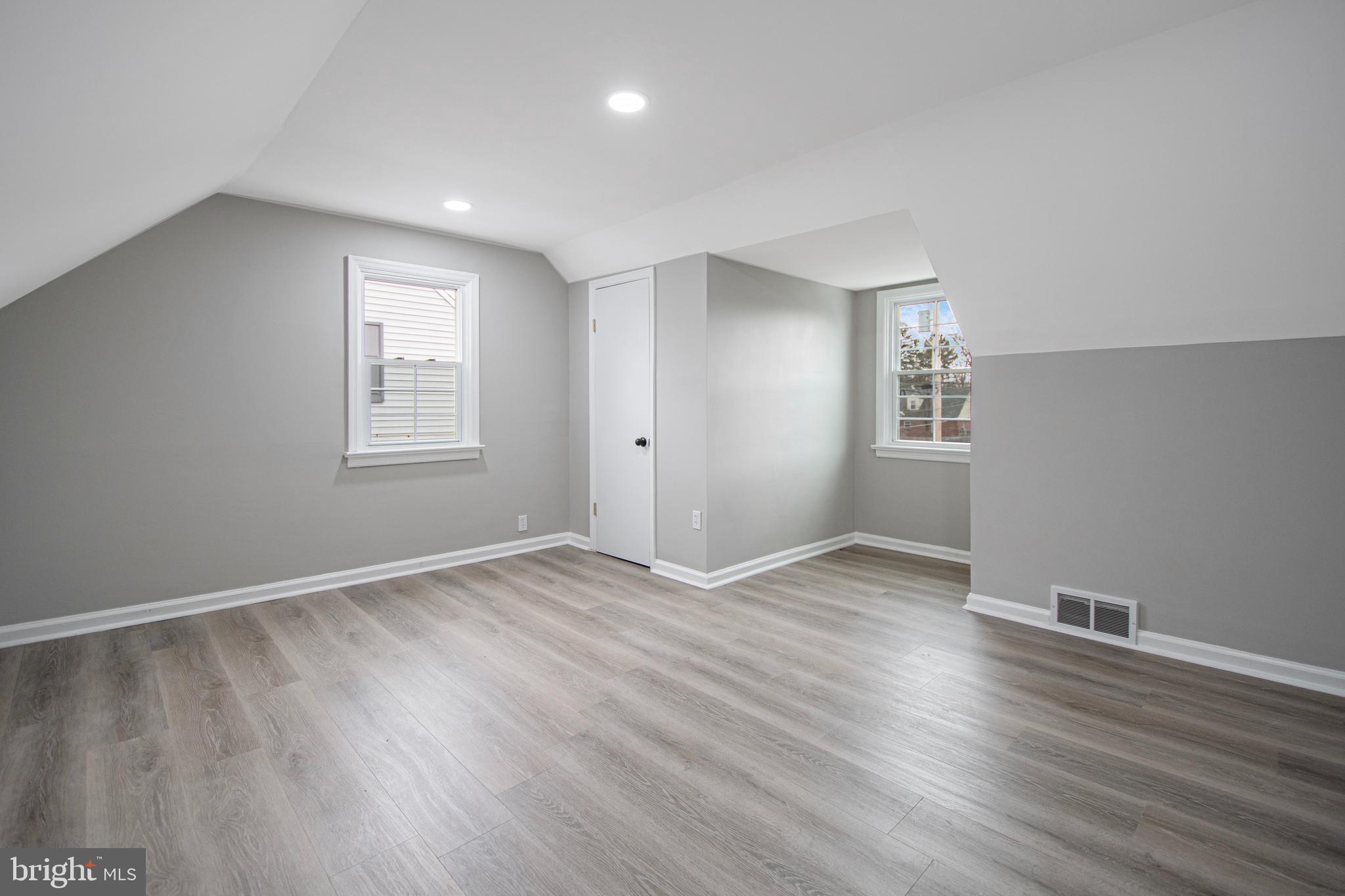 331 Westmoreland Drive Ewing, NJ 08618 - Photo 14 of 28 an empty room with wooden floor and windows