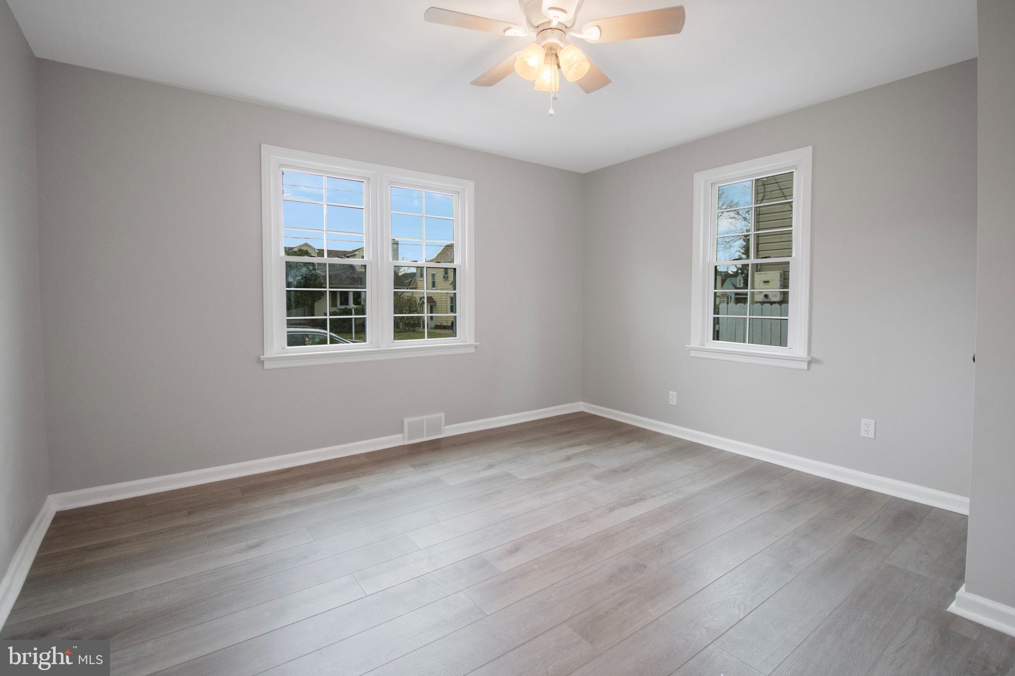 331 Westmoreland Drive Ewing, NJ 08618 - Photo 15 of 28 a view of an empty room with wooden floor and a window