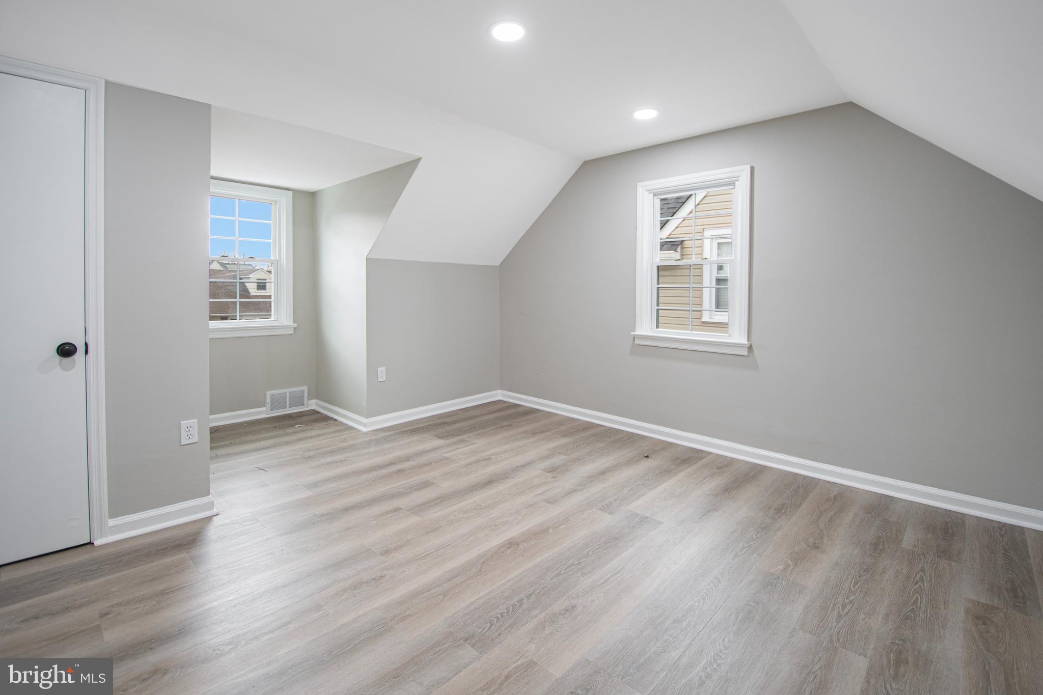 331 Westmoreland Drive Ewing, NJ 08618 - Photo 17 of 28 an empty room with wooden floor and windows