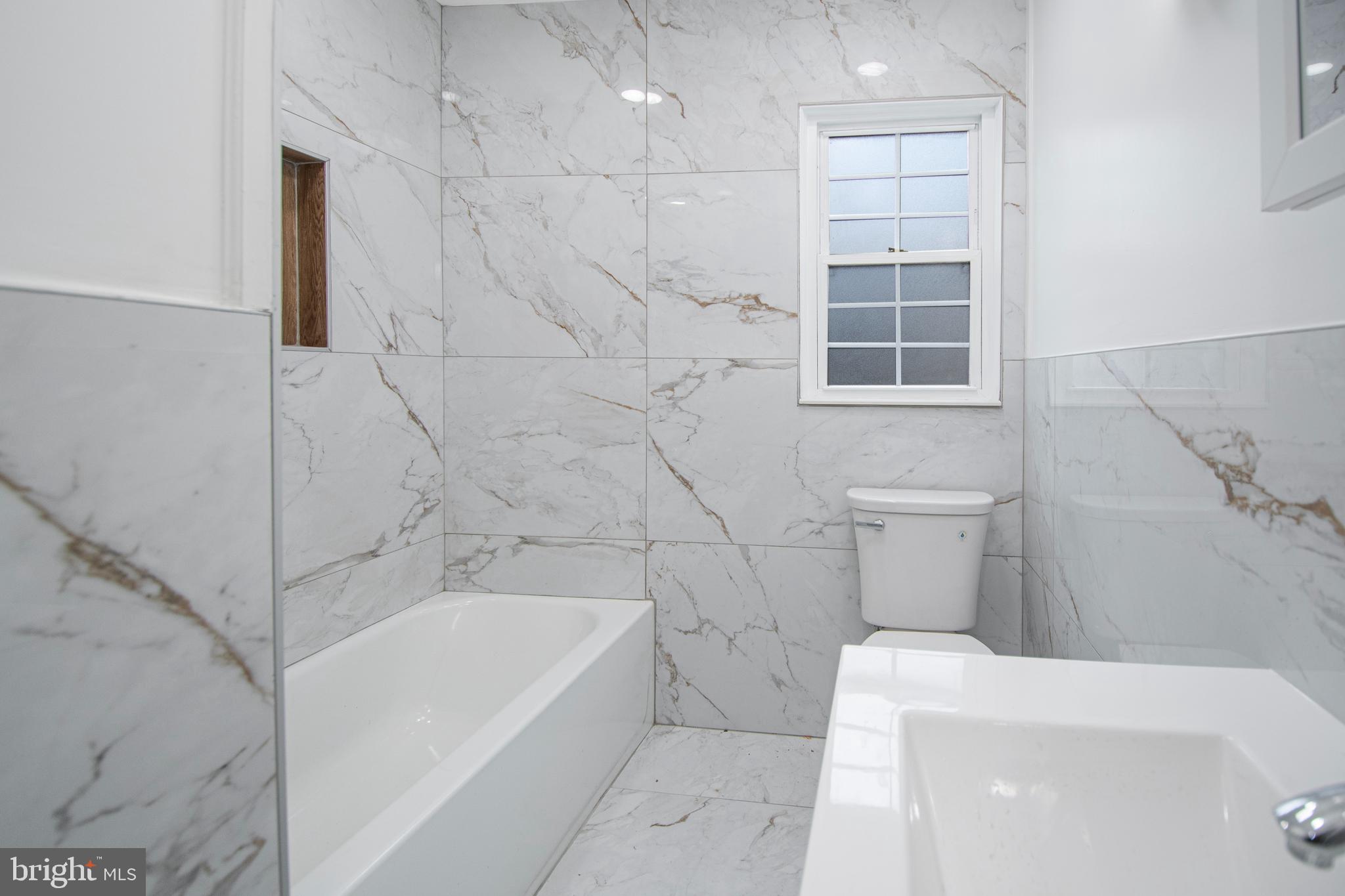 331 Westmoreland Drive Ewing, NJ 08618 - Photo 20 of 28 a bathroom with a bathtub and toilet