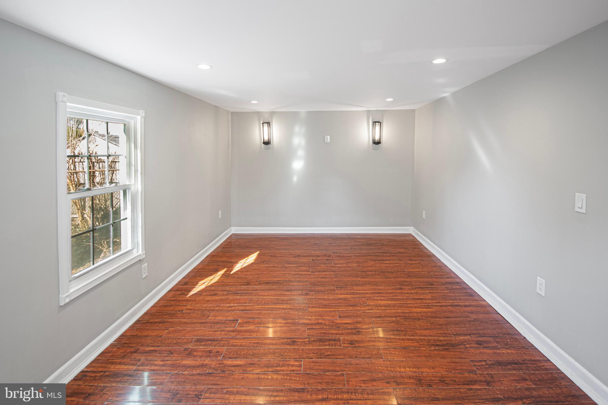 331 Westmoreland Drive Ewing, NJ 08618 - Photo 23 of 28 a view of empty room with wooden floor and fan