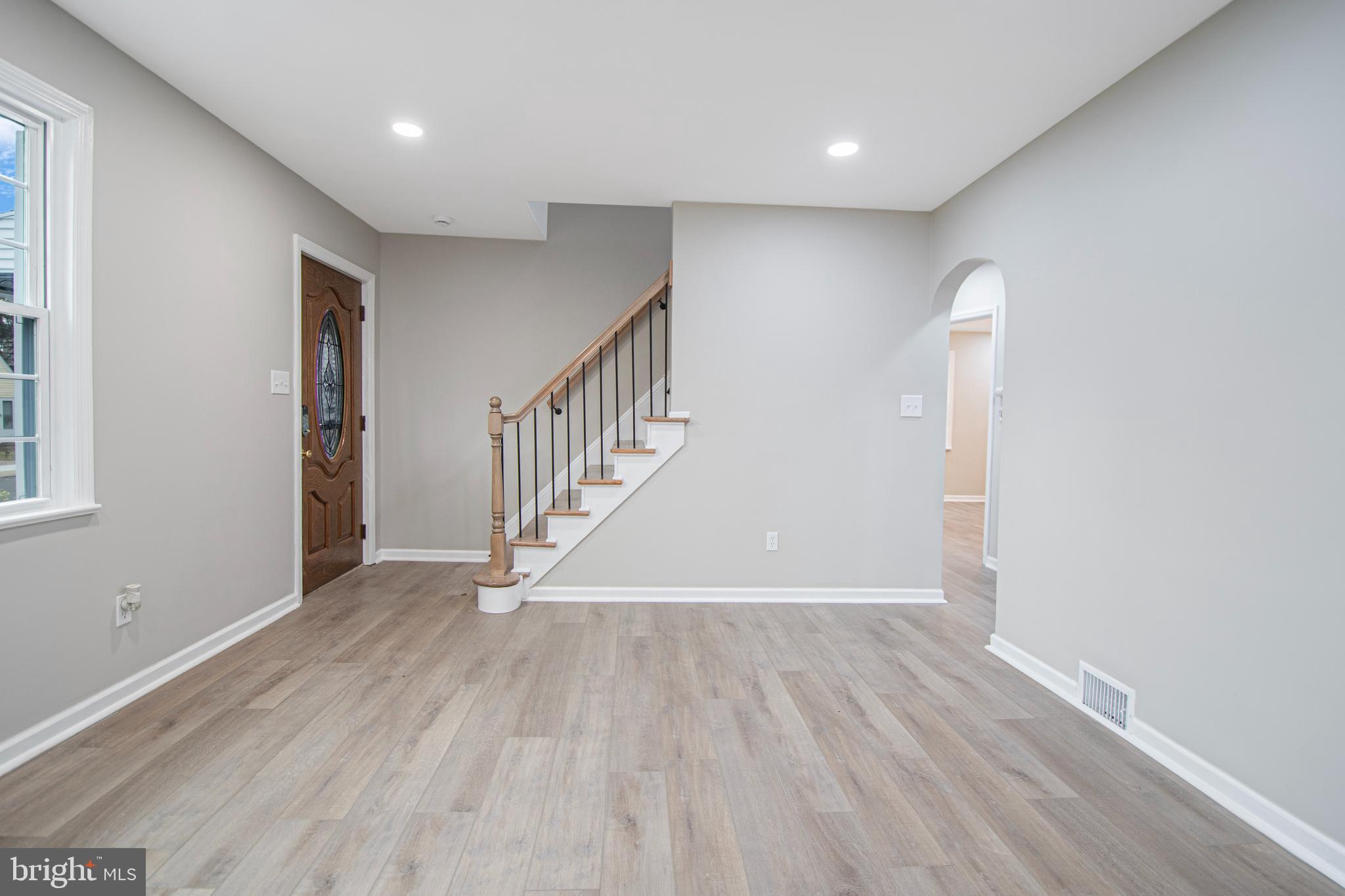 331 Westmoreland Drive Ewing, NJ 08618 - Photo 5 of 28 wooden floor in an empty room with a window