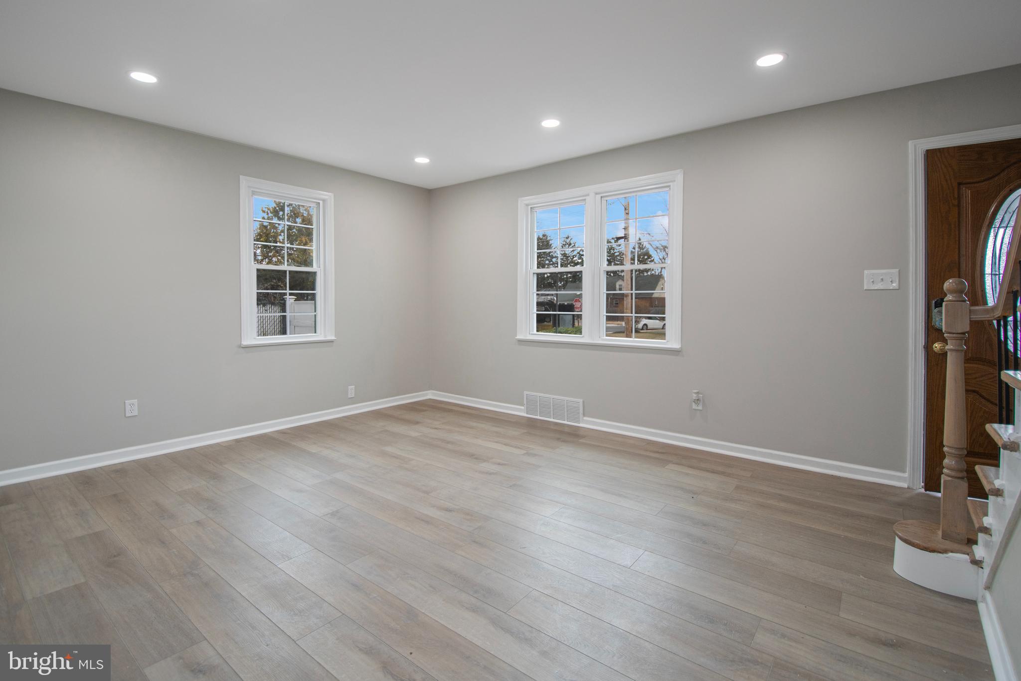 331 Westmoreland Drive Ewing, NJ 08618 - Photo 7 of 28 a view of empty room with wooden floor and fan