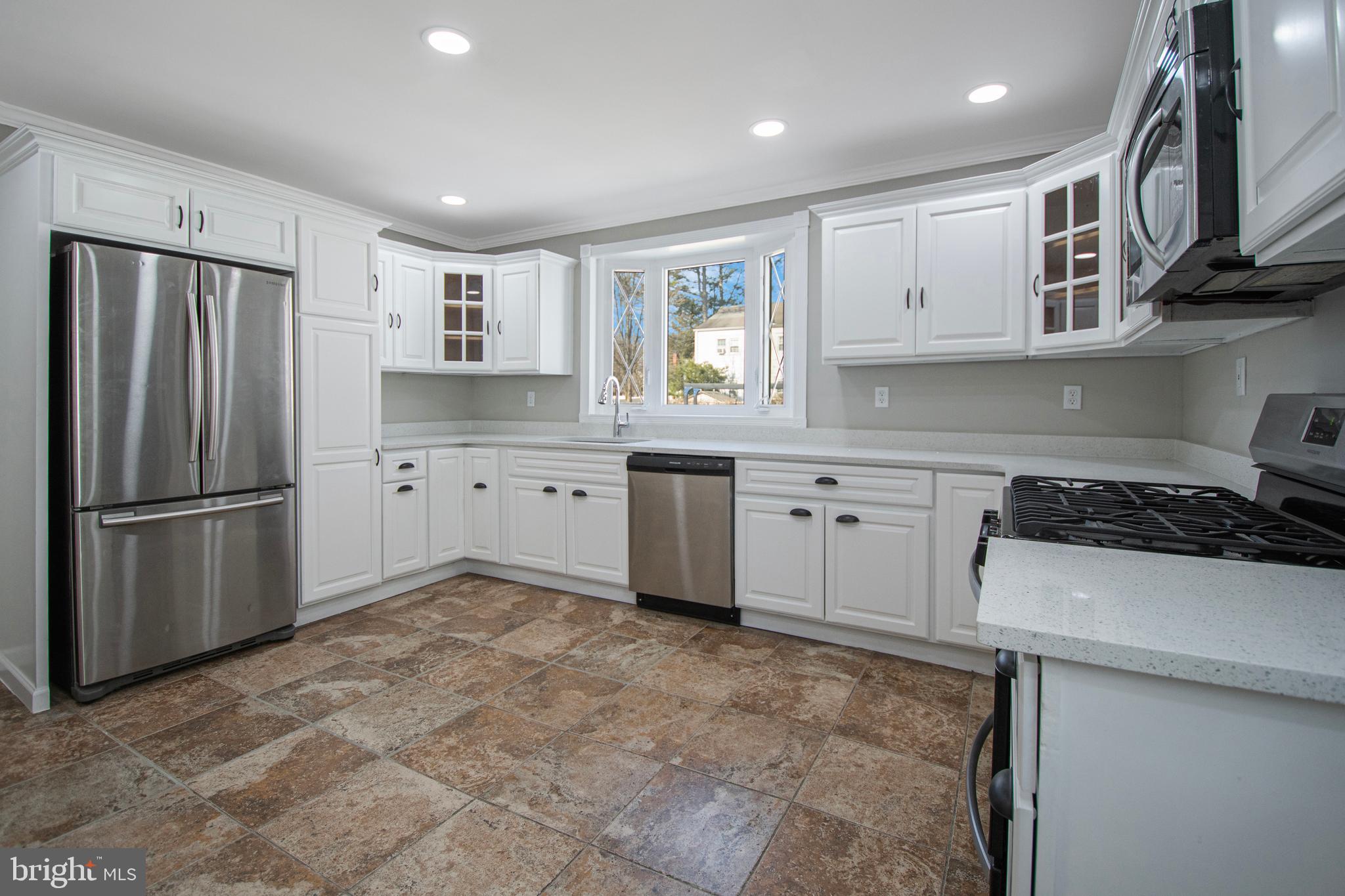331 Westmoreland Drive Ewing, NJ 08618 - Photo 8 of 28 a kitchen with stainless steel appliances granite countertop a refrigerator sink and stove