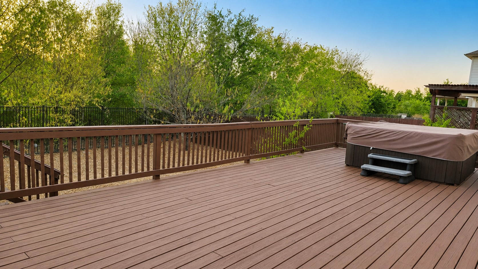 10528 Dunham Forest Road Austin, TX 78717 - Photo 11 of 12 Relax in the hot tub on this well-maintained wood deck with lush green tree views.