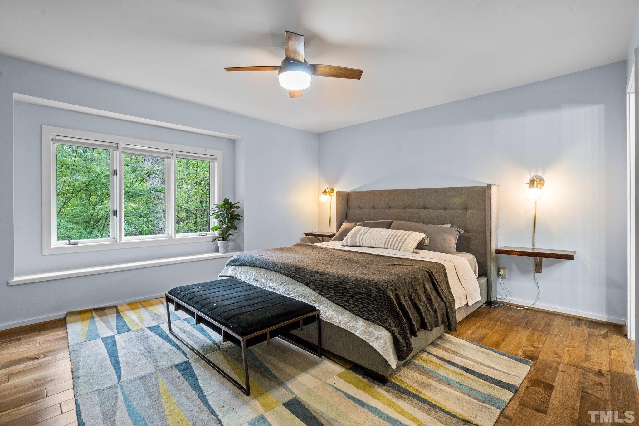 6509 Deerview Drive Raleigh, NC 27606 - Photo 13 of 36 a bedroom with a bed and window