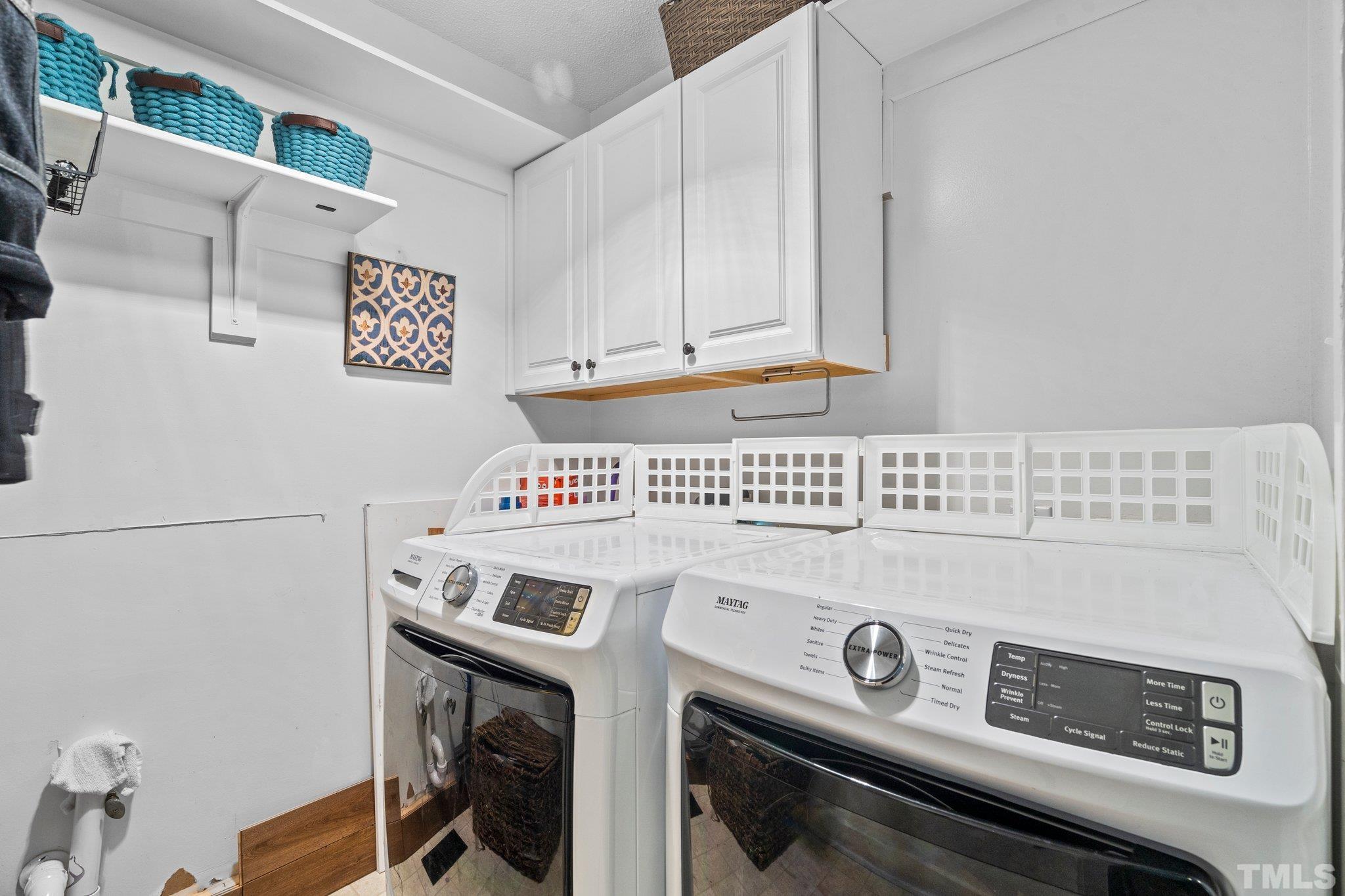 6509 Deerview Drive Raleigh, NC 27606 - Photo 25 of 36 a utility room with dryer and washer