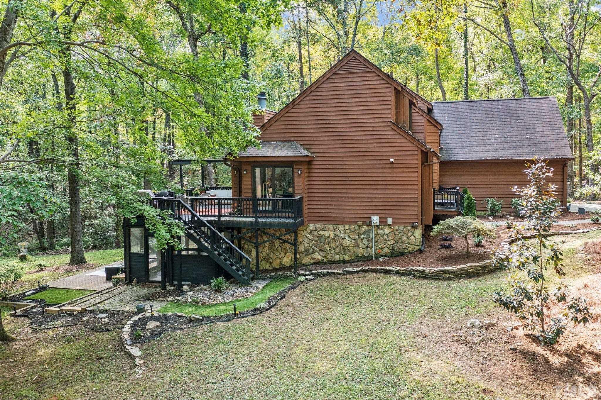 6509 Deerview Drive Raleigh, NC 27606 - Photo 26 of 36 a view of a house with a yard