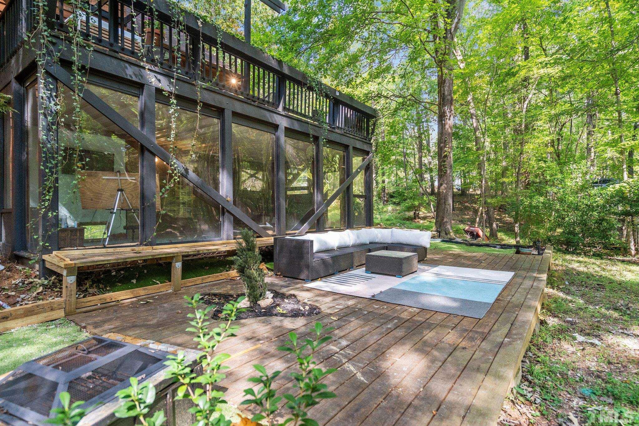 6509 Deerview Drive Raleigh, NC 27606 - Photo 31 of 36 a view of a house with backyard and sitting area
