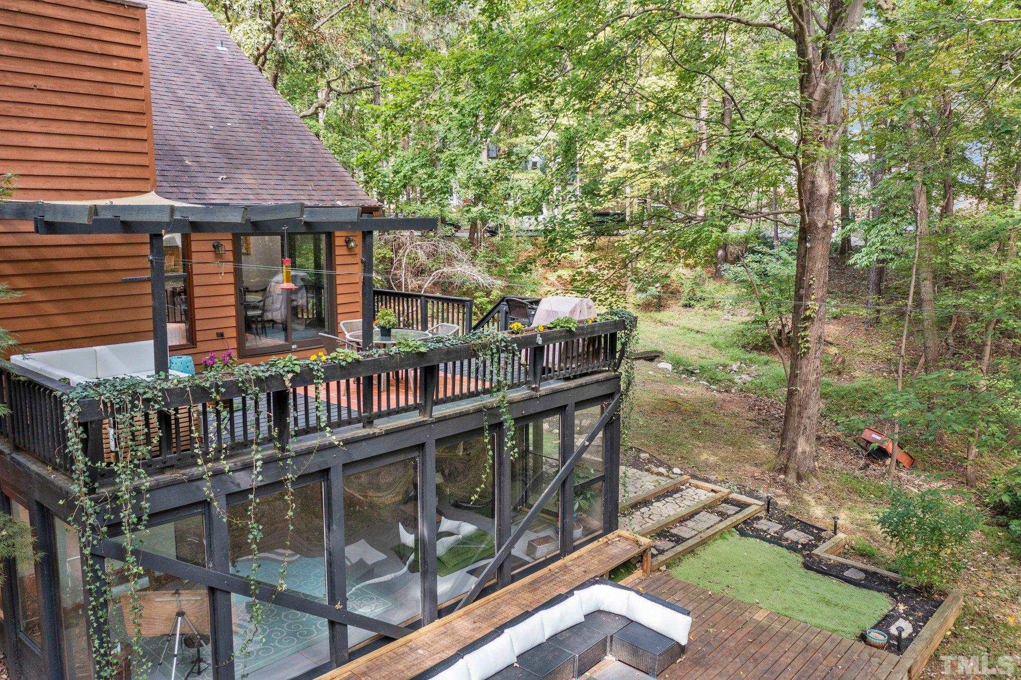 6509 Deerview Drive Raleigh, NC 27606 - Photo 32 of 36 an outdoor view of garden with deck having patio