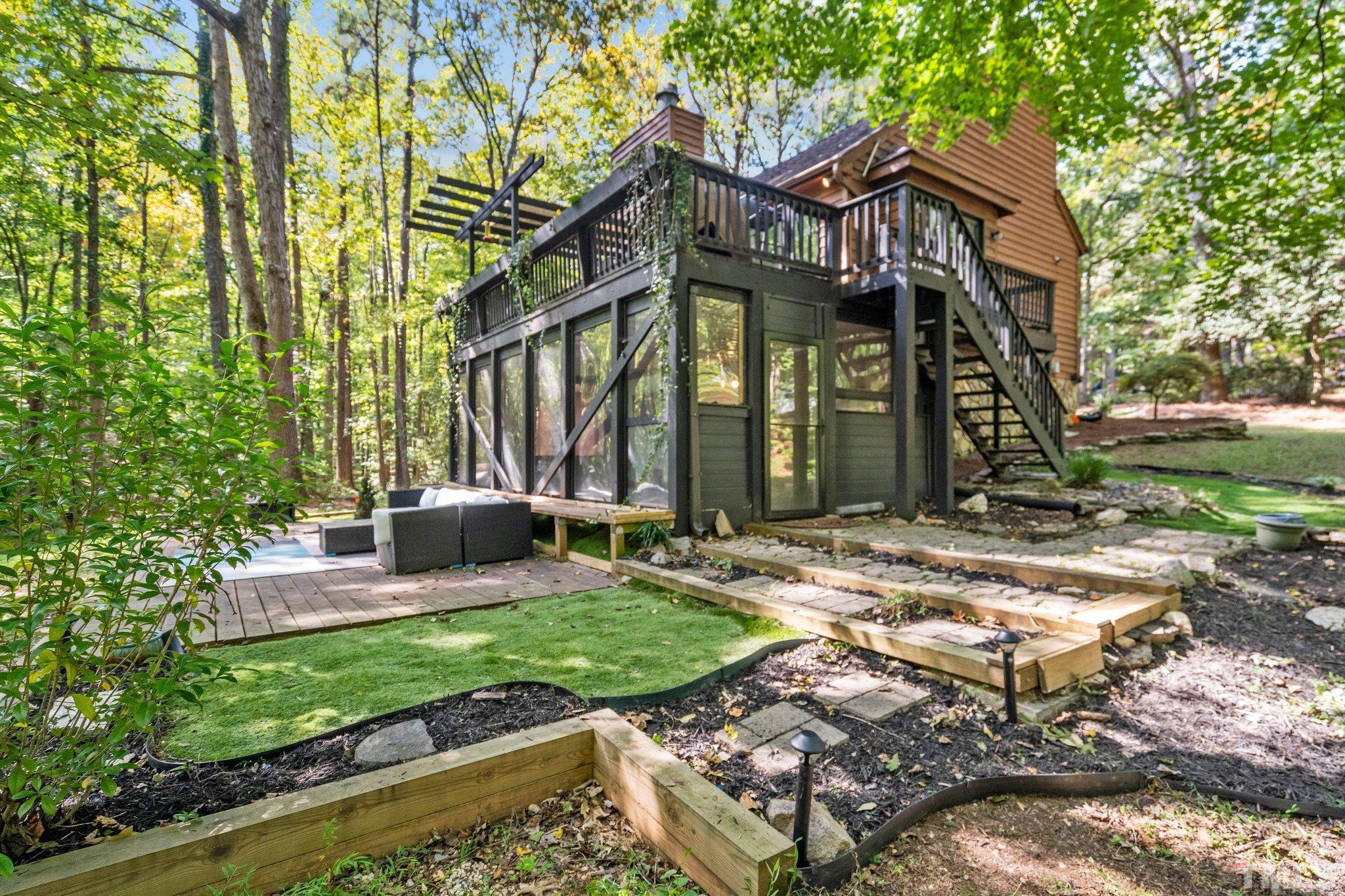 6509 Deerview Drive Raleigh, NC 27606 - Photo 35 of 36 a view of a house with backyard and sitting area