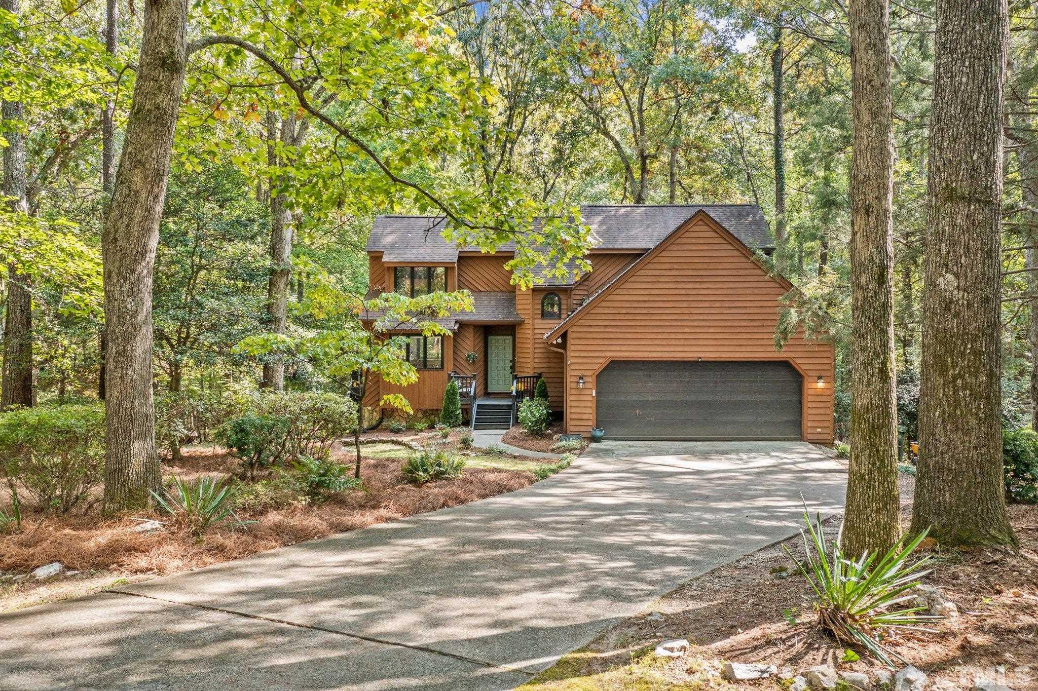 6509 Deerview Drive Raleigh, NC 27606 - Photo 36 of 36 a view of house with yard and garage