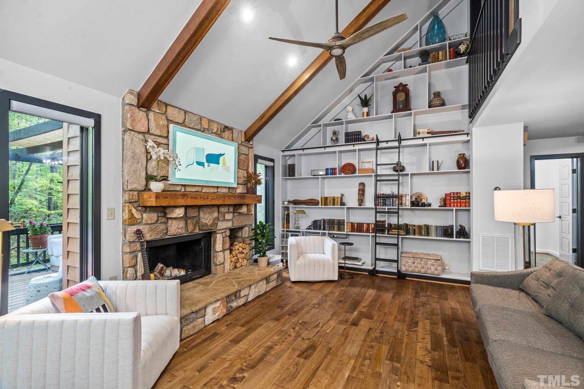 6509 Deerview Drive Raleigh, NC 27606 - Photo 4 of 36 a living room with furniture and a fireplace