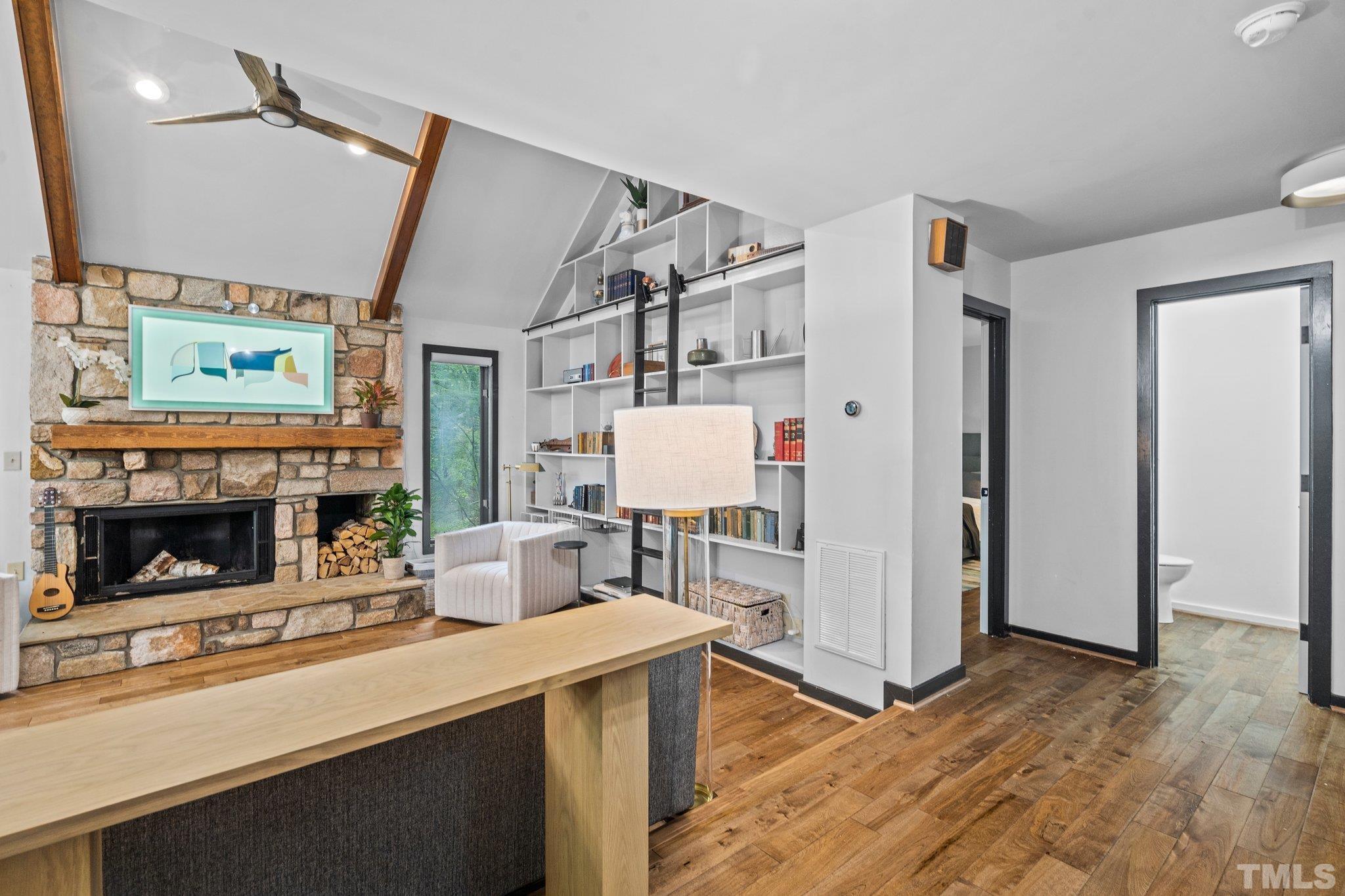 6509 Deerview Drive Raleigh, NC 27606 - Photo 6 of 36 a living room with furniture and a fireplace