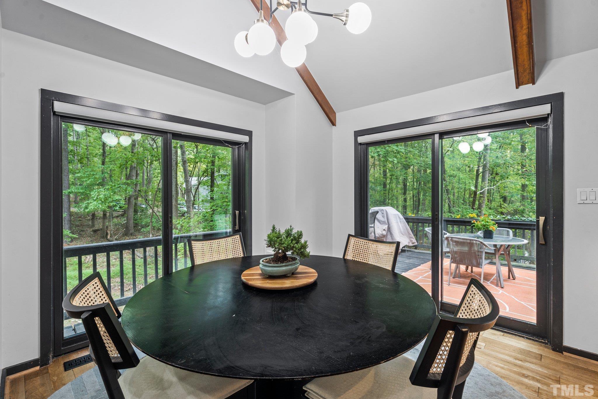 6509 Deerview Drive Raleigh, NC 27606 - Photo 8 of 36 a view of a dining room with furniture window and outside view