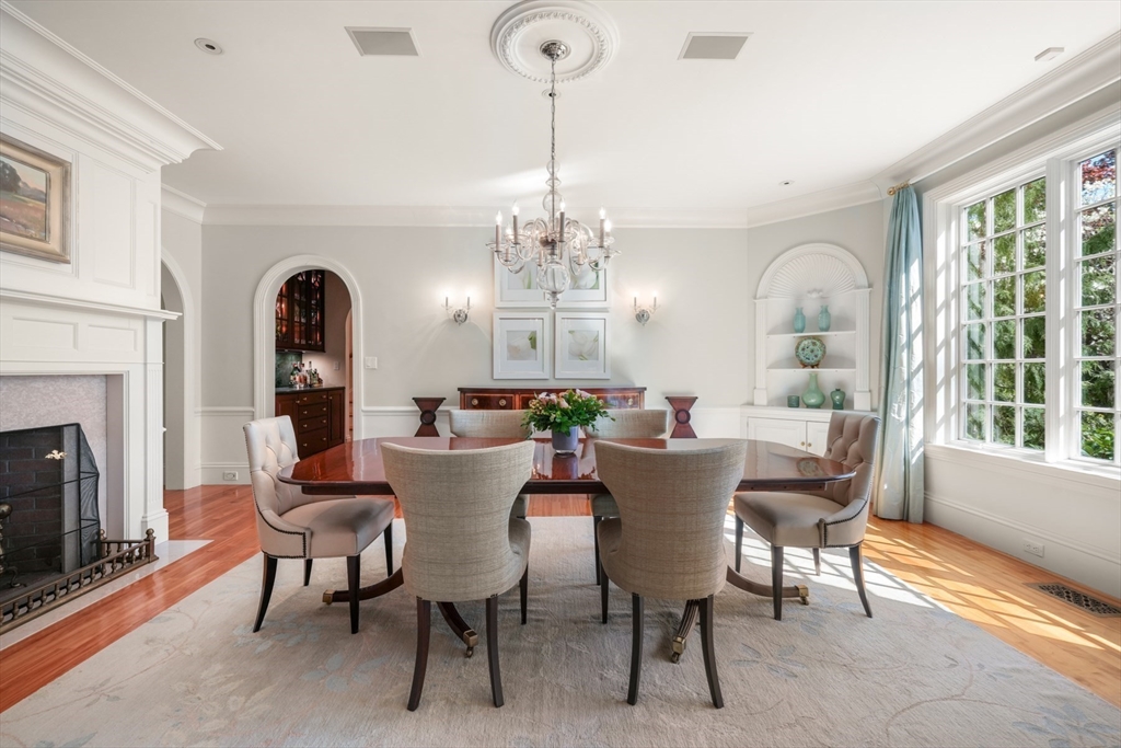 1 Old Farm Road Wellesley, MA 02481 - Photo 15 of 41 a dining room with furniture a chandelier and wooden floor