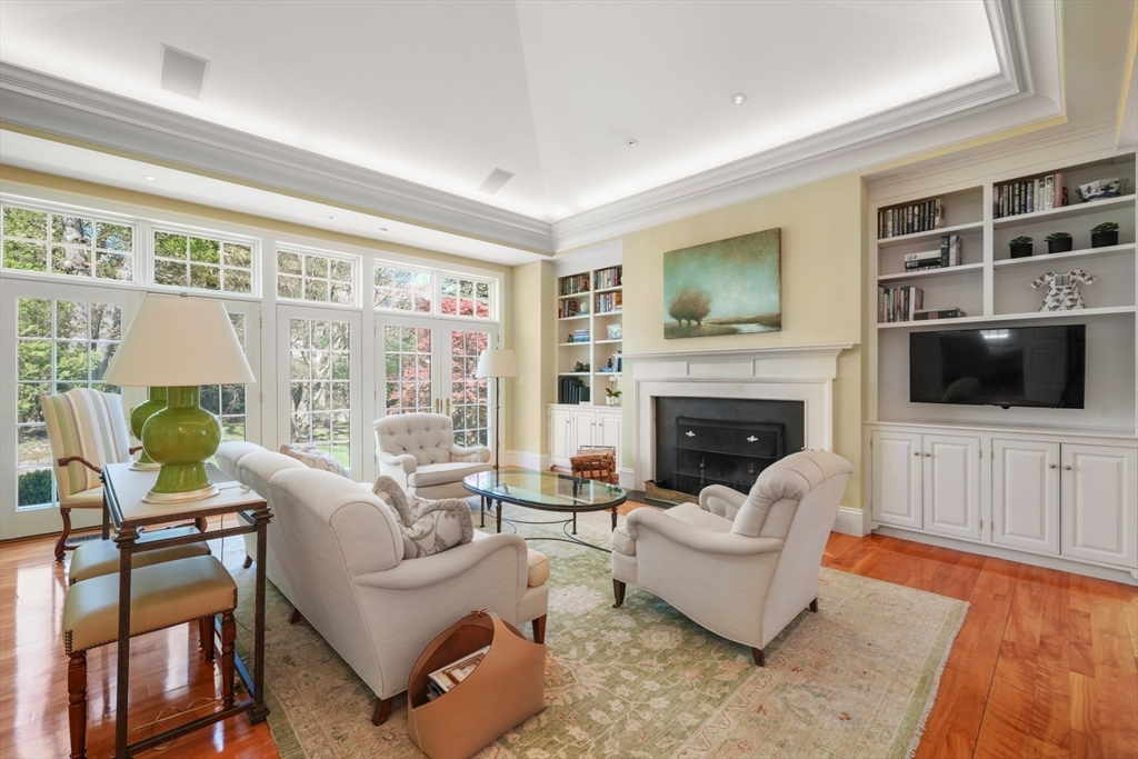 1 Old Farm Road Wellesley, MA 02481 - Photo 23 of 41 a living room with furniture a flat screen tv and a fireplace