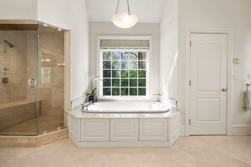 1 Old Farm Road Wellesley, MA 02481 - Photo 31 of 41 a spacious bathroom with a granite countertop tub shower and sink