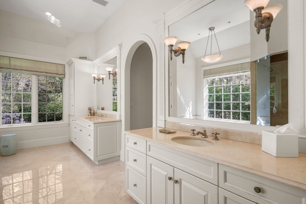 1 Old Farm Road Wellesley, MA 02481 - Photo 33 of 41 a spacious bathroom with a granite countertop sink mirror and a bathtub