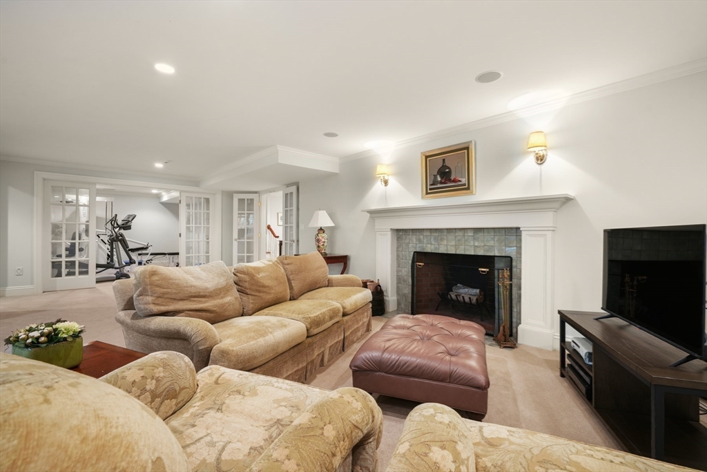 1 Old Farm Road Wellesley, MA 02481 - Photo 35 of 41 a living room with furniture and a fireplace