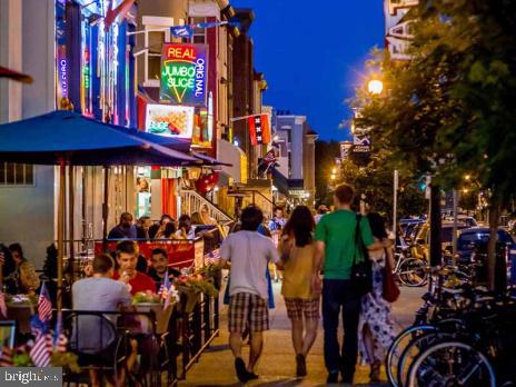 2509 17th Street Northwest, Unit 1 Washington, DC 20009 - Photo 19 of 23 a group of people sitting outside of a city