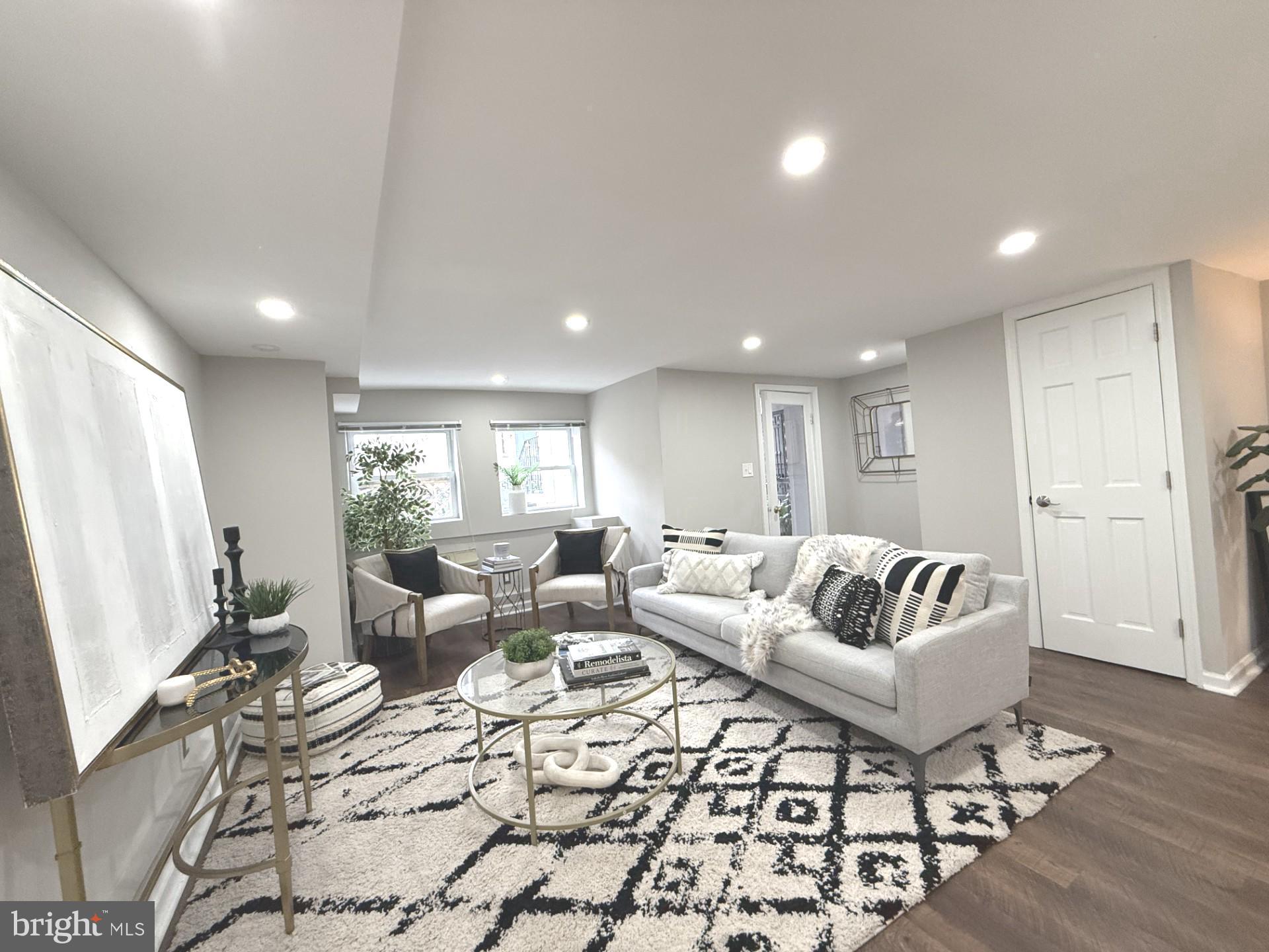 2509 17th Street Northwest, Unit 1 Washington, DC 20009 - Photo 2 of 23 a living room with furniture and a flat screen tv