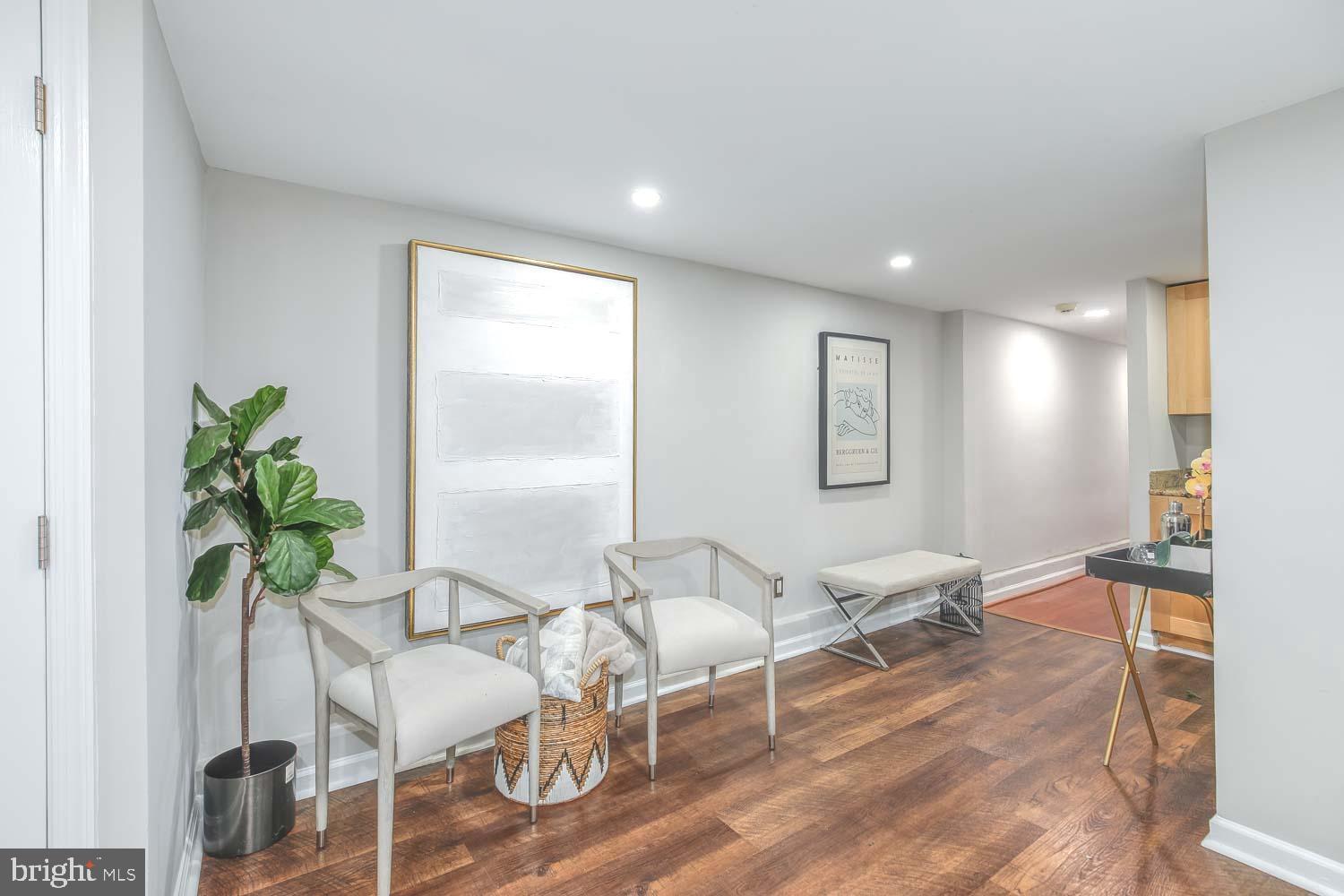 2509 17th Street Northwest, Unit 1 Washington, DC 20009 - Photo 6 of 23 a living room with furniture and a potted plant