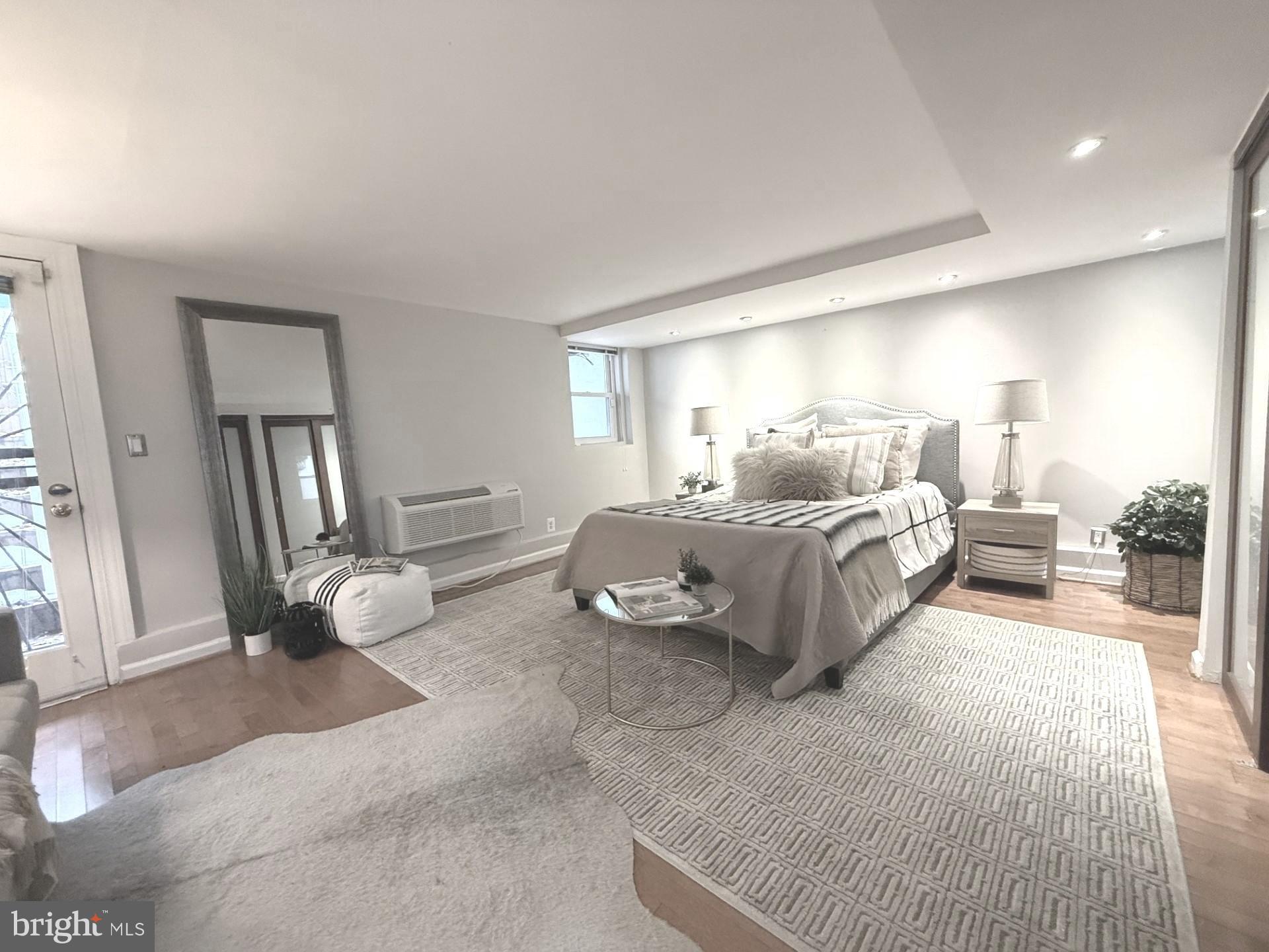 2509 17th Street Northwest, Unit 1 Washington, DC 20009 - Photo 7 of 23 a bedroom with furniture and a large window