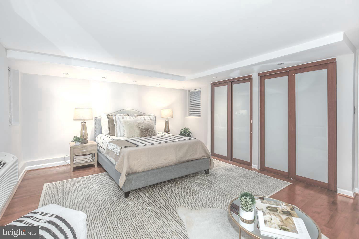 2509 17th Street Northwest, Unit 1 Washington, DC 20009 - Photo 8 of 23 a bedroom with a bed and a window