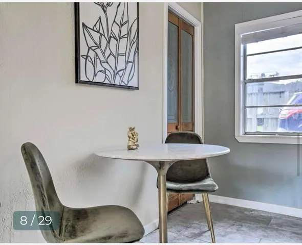 a room with a chair and a window