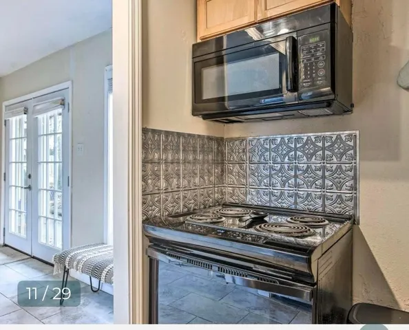 a kitchen with a stove and a microwave