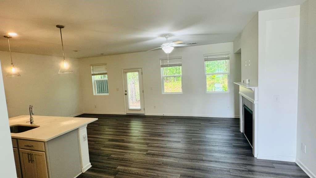 4078 Haleston Road Duluth, GA 30097 - Photo 6 of 25 a view of empty room with wooden floor and fan