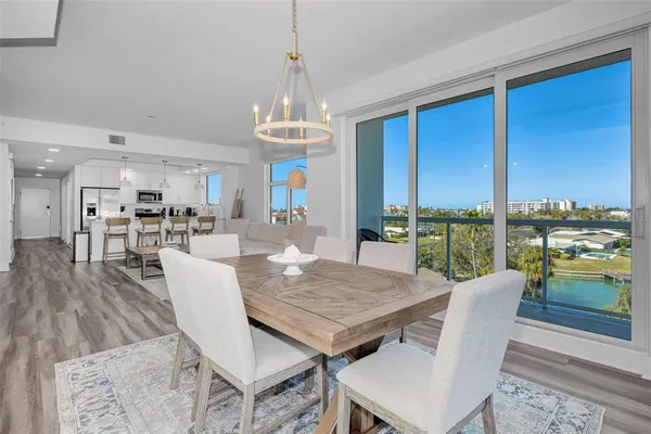 a kitchen with stainless steel appliances a refrigerator sink and stove