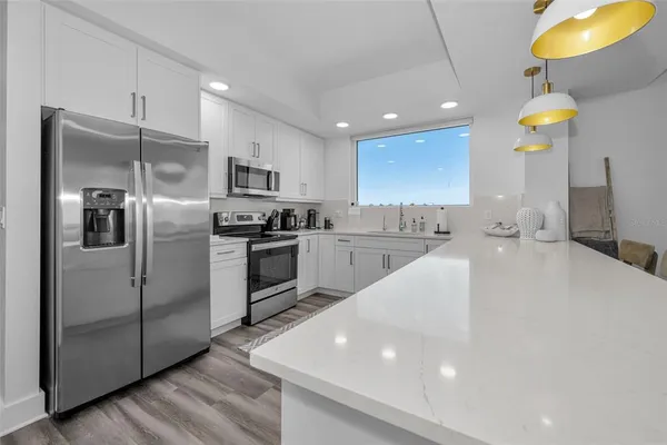 a bedroom with a bed a couch and a couch