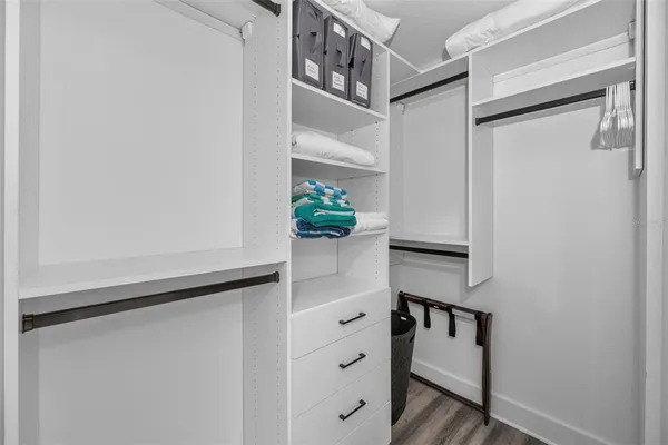 a bedroom with a bed and a cabinets